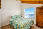 The loft features a queen bed with a view.
